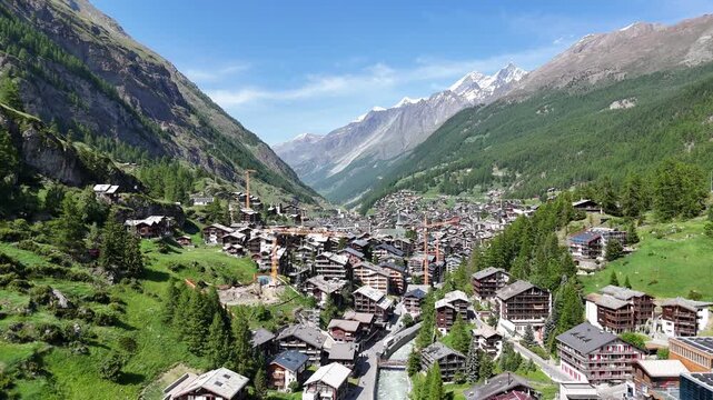 Ascending drone,aerial Zermatt town summer, Swizerland
