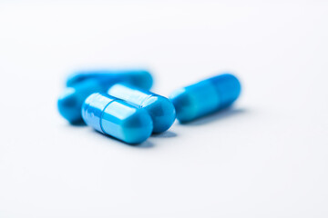 Amino acids capsules on bright background. Soft focus. Close up. Copy space.	
