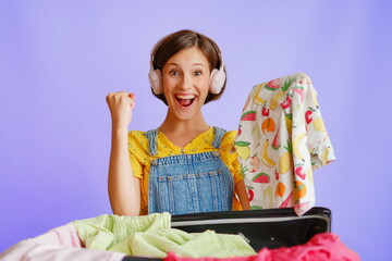 Happy female in headphones giving thumbs up with t-shirt on white background for shopping campaigns
