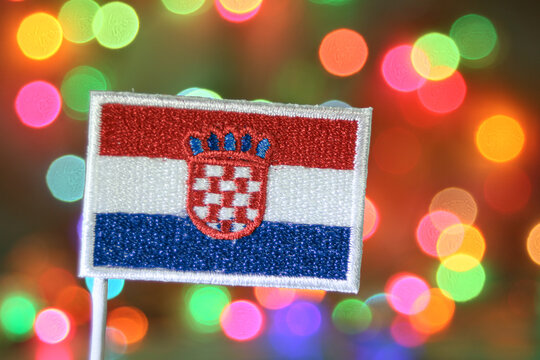 Croatia national flag embroidery patch with colorful bokeh fireworks background, perfect for holiday, Christmas, and New Year celebration themes.