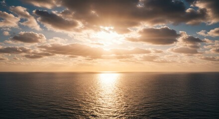 Ocean horizon with sunlight reflecting on water under a cloudy sky.