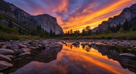 River reflects a colorful sunset sky with mountains and trees in background.