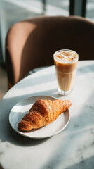 Fresh Butter Croissant with Iced Coffee on Café Table