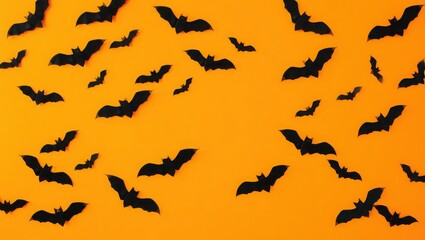 A halloween themed background featuring a pattern of black paper bats on an orange gradient background