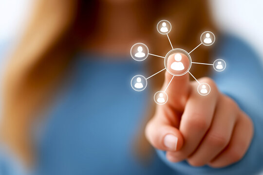 Woman is pointing at digital network of people icons, showcasing social media connections and online interaction in a contemporary, technology driven atmosphere