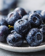 Fresh juicy blueberries on plate, kitchen counter background, healthy food photography, recipe website