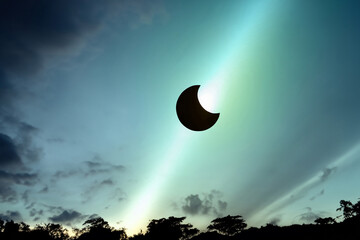 Partial solar eclipse in the evening sky