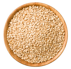 Roasted sesame in the wooden bowl, isolated on white background, top veiw.