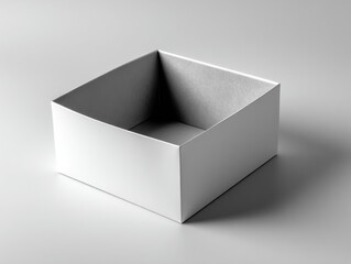 Empty white square box on light gray surface