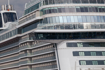 Cruise ship close-up. View of the cabins and balconies of a large cruise ship from the bow side