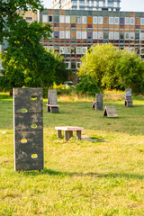 Urban dog training ground with wooden obstacles, ramps and agility equipment in public park,...