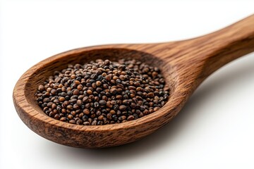 Wheat grains in a wooden spoon isolated on a white background
