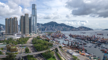 June 29 2025 Panoramic View of Busy Urban Harbor with Skyscrapers