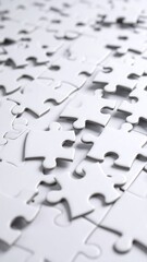 Close-up of many white jigsaw puzzle pieces