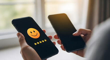 Person holding two smartphones with a smiley face and star rating on screen