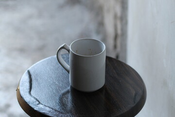 cup of coffee on wooden background