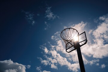 Basketball hoop against a vibrant blue sky (1)