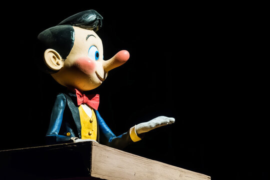 Pinocchio at the political podium, the concept of lies and populism, copyspace