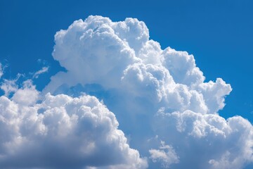 Fluffy white cumulus clouds against a vibrant blue sky