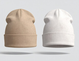 Two classic cuffed beanies, one beige and one white, floating against a plain light gray background.