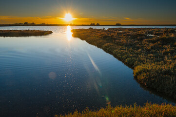sunset over the lagoon, Po river delta, Comacchio, Ferrara, Italy