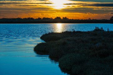 sunset over the lagoon, Po river delta, Comacchio, Ferrara, Italy