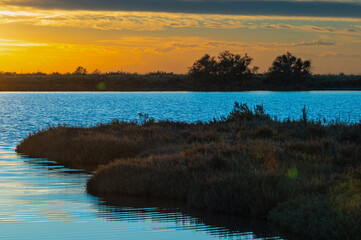 sunset over the lagoon, Po river delta, Comacchio, Ferrara, Italy