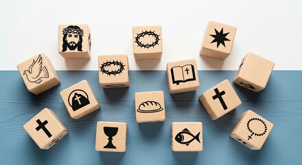 Wooden cubes with Christian symbols on white and blue background, representing faith and religion. Concept for spiritual learning and education.