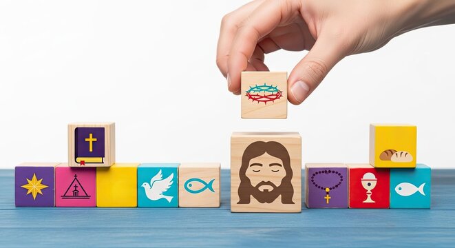 A man holding a wooden block with the crown of thorns symbol above other christianity related blocks. Christmas and Easter concept.