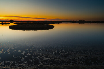 sunset over the lagoon, Po river delta, Comacchio, Ferrara, Italy