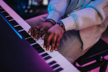 A close-up shot of a musician's hands as they play the keyboard, capturing the artistic expression...