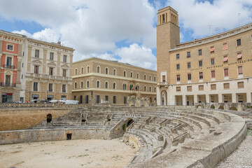 Anfiteatro Romano – Ancient Roman Amphitheater with Stone Seating and Historic Surroundings,...