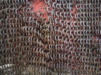 Chain mail texture. Old chain mail. Rusty texture of rings. Knights' clothing. Museum