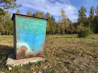 Garbage can in the park. Ecology. Clean environment. Trash can. Old rusty garbage can
