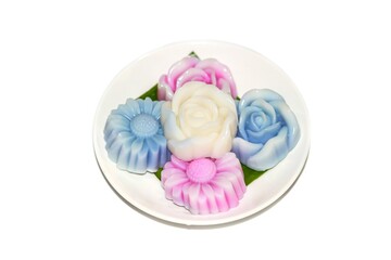 Pictures of dessert with jelly dessert flowers designed serving on dish plates and isolate concept.