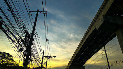 bridge at sunset, Evening sky with power lines and poles