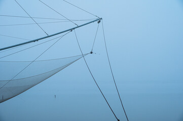 Fototapeta premium fishing net close up inside the Po river delta lagoon, Comacchio, Ferrara, Italy