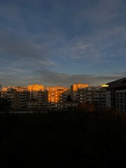 Golden sunlight on apartment block buildings at sunset