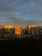 Golden sunlight on apartment block buildings at sunset