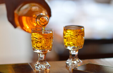 glasses and bottle with alcohol drink close up
