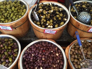 Assorted Olives in Wooden Barrels at The European Street Market Outdoor