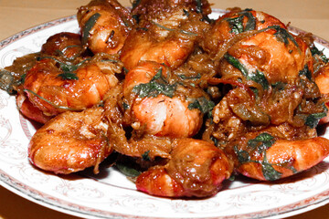 Spicy Prawn Curry or Chingri Bhuna - Delicious and Traditional South Asian Cuisine Presented on a Plate, Perfect for Food Blogs and Restaurants.