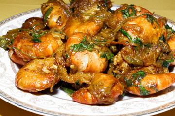Spicy Prawn Curry or Chingri Bhuna - Delicious and Traditional South Asian Cuisine Presented on a Plate, Perfect for Food Blogs and Restaurants.