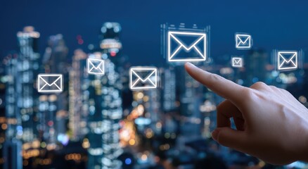 Hand points to email icons over a city skyline