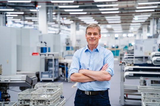 Portrait of a confident businessman in a factory