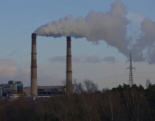 Industrial smokestacks against a twilight sky