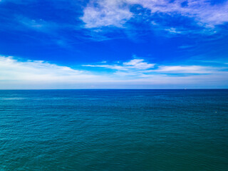 Aerial view of a sea surface water texture background and sun reflections Aerial flying drone view Waves water surface texture on sunny tropical ocean