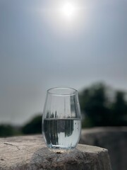 glass of water on the beach