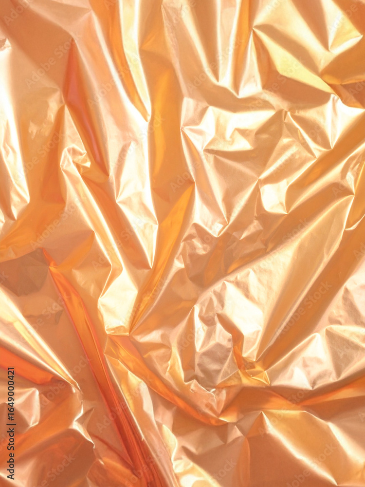 Poster a close-up shot capturing the intricate folds and reflective surface of crumpled gold foil. the warm
