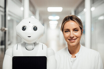 Healthcare professional and robot in modern medical research environment